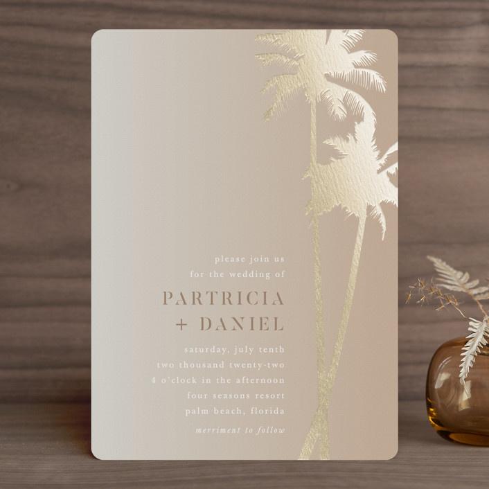 Metallic gold palm tree and type on light brown background
