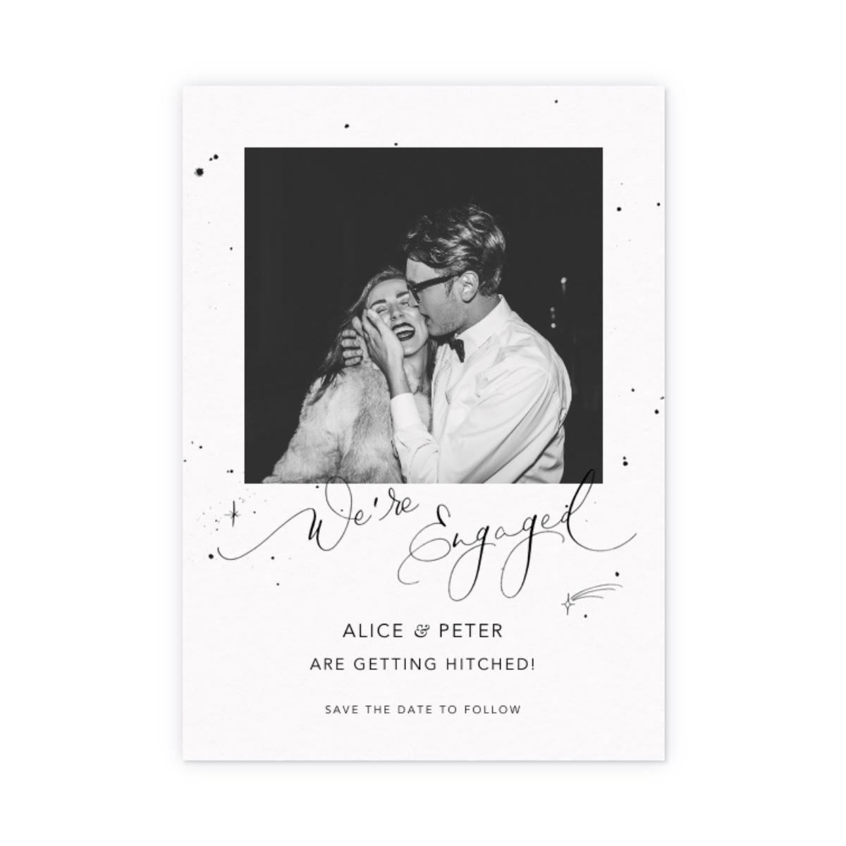 Personalized black and white photo and 'We're engaged!' in black calligraphy